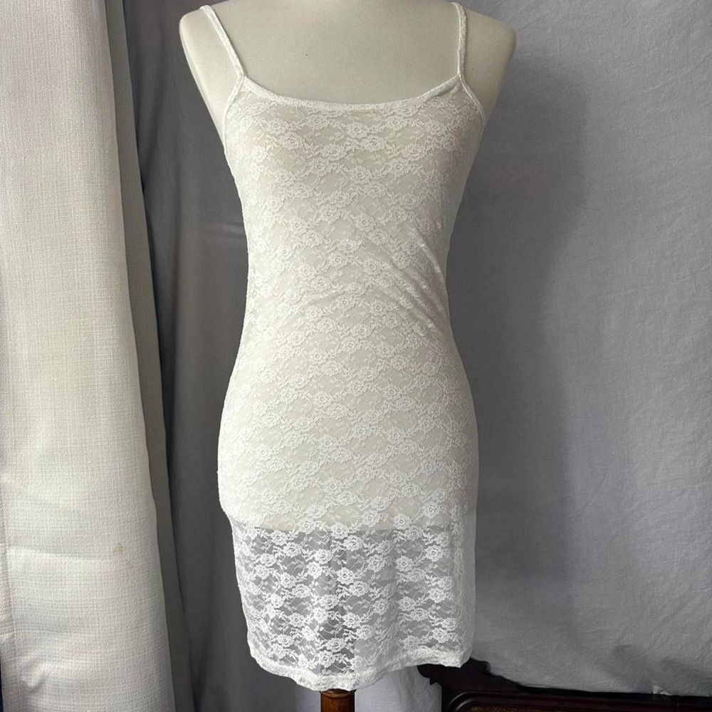 Edited white stretchy lace body con dress